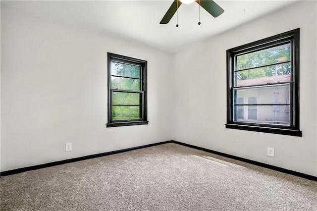 1910 Ottawa St, Leavenworth, KS 66048 - carpeted empty room with a ceiling fan and baseboards