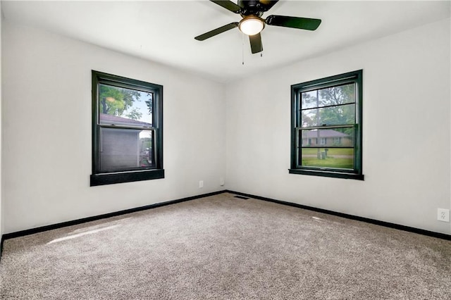 1910 Ottawa St, Leavenworth, KS 66048 - spare room featuring plenty of natural light, carpet flooring, and baseboards
