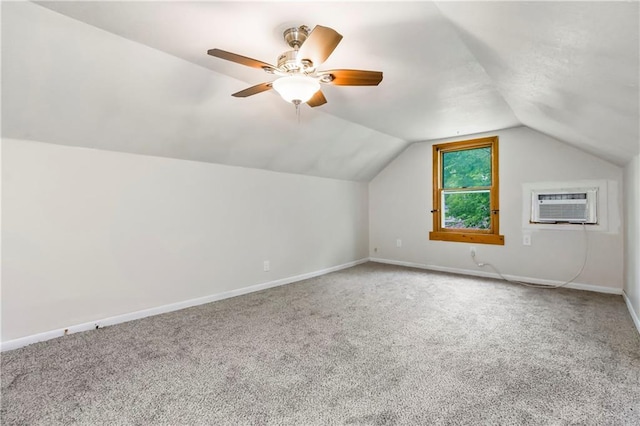 1910 Ottawa St, Leavenworth, KS 66048 - additional living space with a wall mounted air conditioner, carpet flooring, vaulted ceiling, baseboards, and ceiling fan