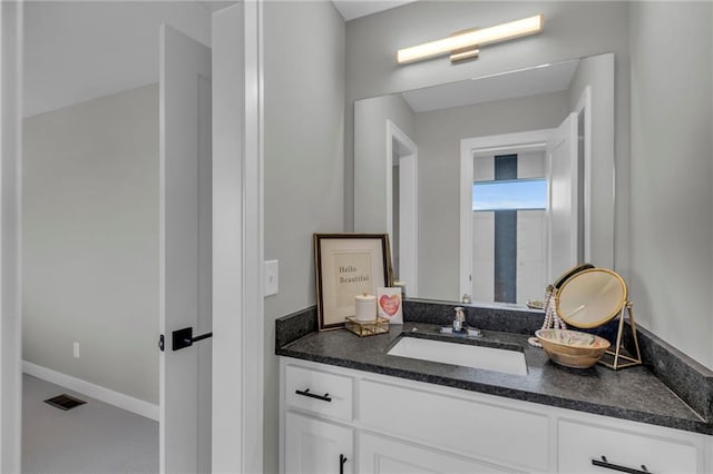 bathroom with visible vents and vanity