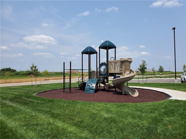 community jungle gym with a yard