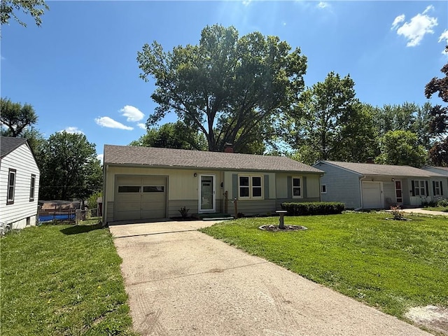 ranch-style home featuring a garage, driveway, and a front lawn