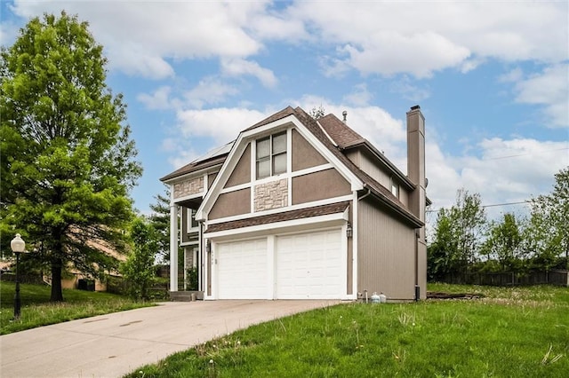 6700 N Charlston Dr, Kansas City, MO 64119 - view of front of house with an attached garage, concrete driveway, a chimney, stone siding, and stucco siding