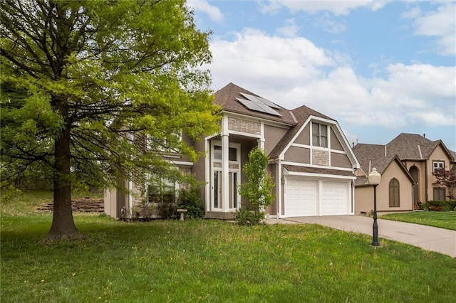 6700 N Charlston Dr, Kansas City, MO 64119 - view of front facade featuring a garage, solar panels, driveway, a front yard, and stucco siding
