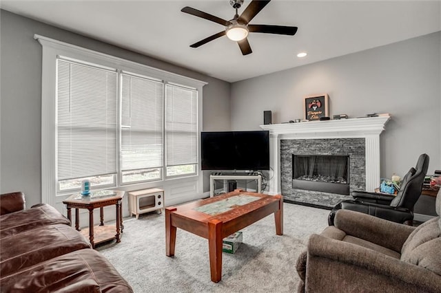 6700 N Charlston Dr, Kansas City, MO 64119 - carpeted living room featuring a fireplace, ceiling fan, and recessed lighting