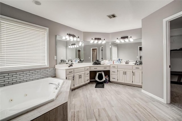 6700 N Charlston Dr, Kansas City, MO 64119 - full bath with a whirlpool tub and vanity