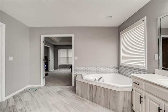 6700 N Charlston Dr, Kansas City, MO 64119 - full bathroom with a garden tub and vanity