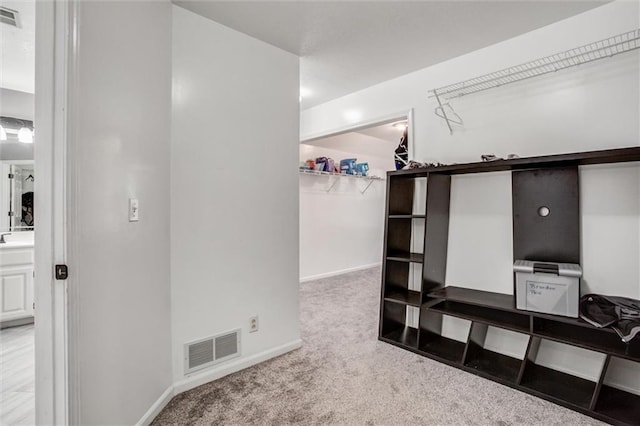6700 N Charlston Dr, Kansas City, MO 64119 - spacious closet featuring carpet flooring