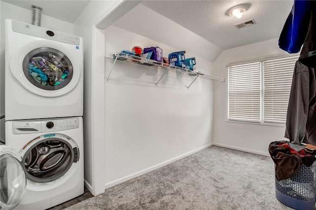 6700 N Charlston Dr, Kansas City, MO 64119 - laundry room with stacked washer / drying machine, carpet floors, and baseboards