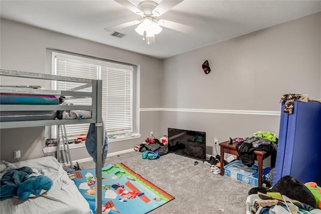 6700 N Charlston Dr, Kansas City, MO 64119 - carpeted bedroom featuring baseboards and a ceiling fan