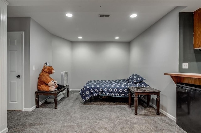 6700 N Charlston Dr, Kansas City, MO 64119 - carpeted bedroom with refrigerator, baseboards, and recessed lighting