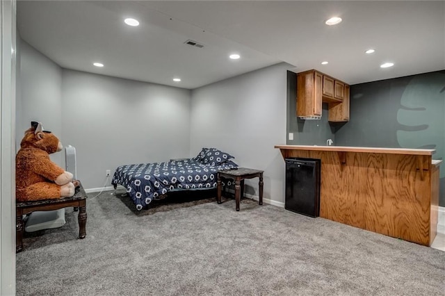 6700 N Charlston Dr, Kansas City, MO 64119 - carpeted bedroom featuring baseboards, bar area, and recessed lighting