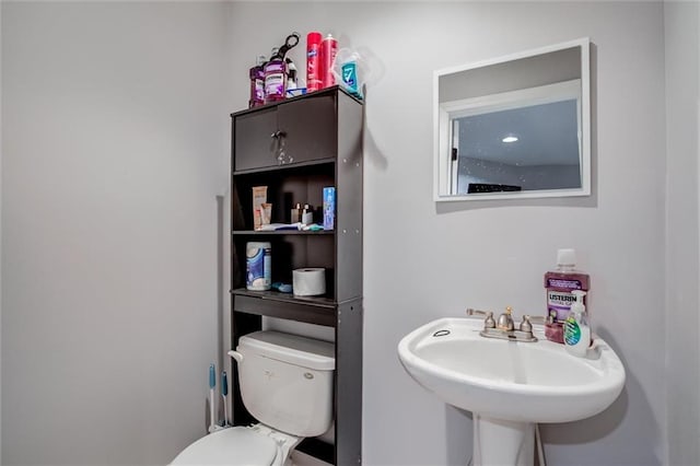 6700 N Charlston Dr, Kansas City, MO 64119 - half bath featuring toilet and a sink