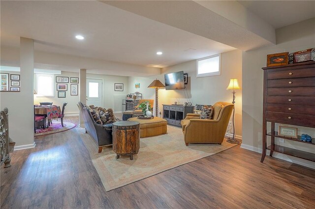 living room with wood finished floors, recessed lighting, and baseboards