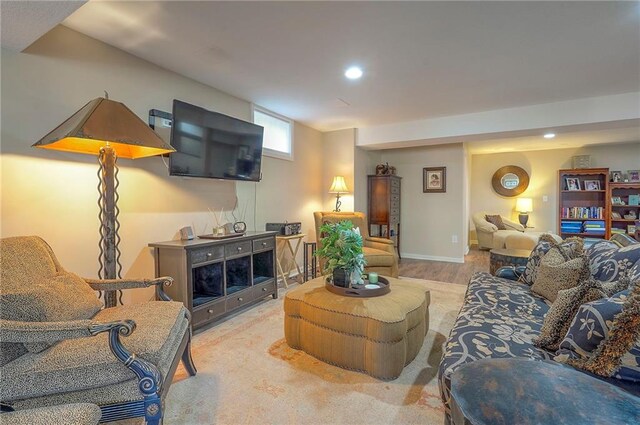 living area featuring wood finished floors and recessed lighting