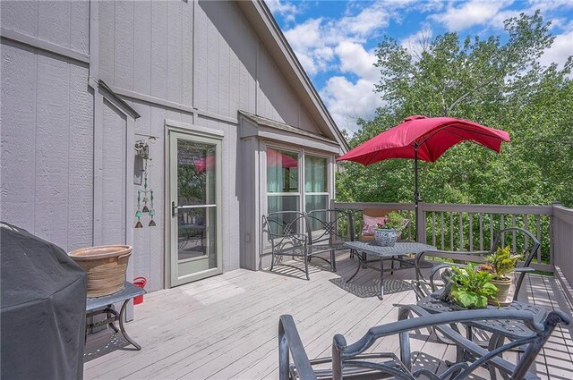 wooden deck with grilling area