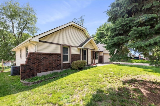 515 London Way, Belton, MO 64012 - ranch-style house featuring brick siding, central air condition unit, a garage, and a front yard