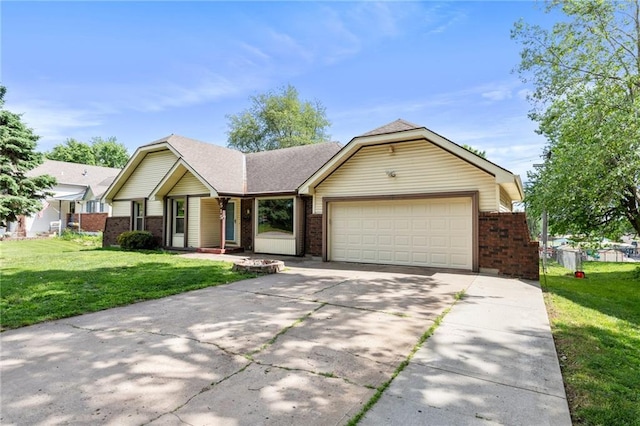 515 London Way, Belton, MO 64012 - view of front facade with brick siding, an attached garage, driveway, and a front lawn