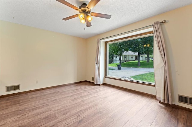 515 London Way, Belton, MO 64012 - empty room featuring light wood-style flooring, baseboards, a ceiling fan, and a textured ceiling