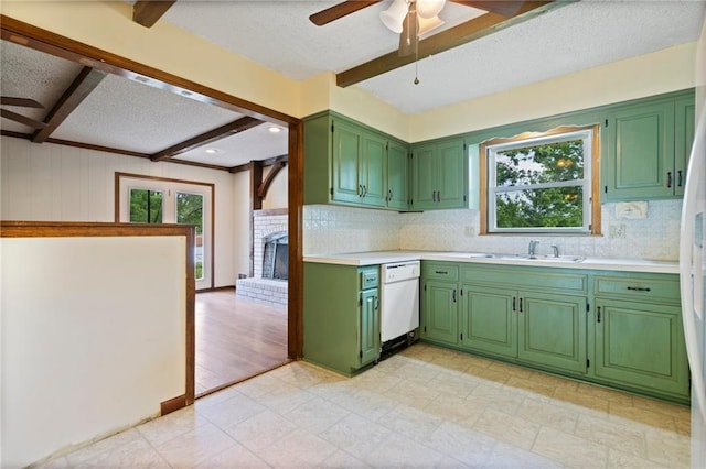 515 London Way, Belton, MO 64012 - kitchen with dishwasher, ceiling fan, a textured ceiling, healthy amount of natural light, and a sink