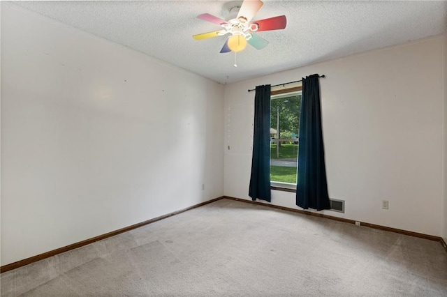 515 London Way, Belton, MO 64012 - spare room with a textured ceiling, carpet floors, ceiling fan, and baseboards