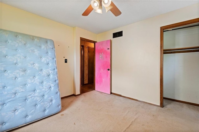 515 London Way, Belton, MO 64012 - unfurnished bedroom with carpet flooring, baseboards, a closet, and a ceiling fan
