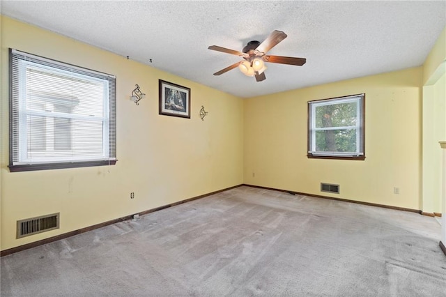 515 London Way, Belton, MO 64012 - spare room featuring carpet, a ceiling fan, baseboards, and a textured ceiling