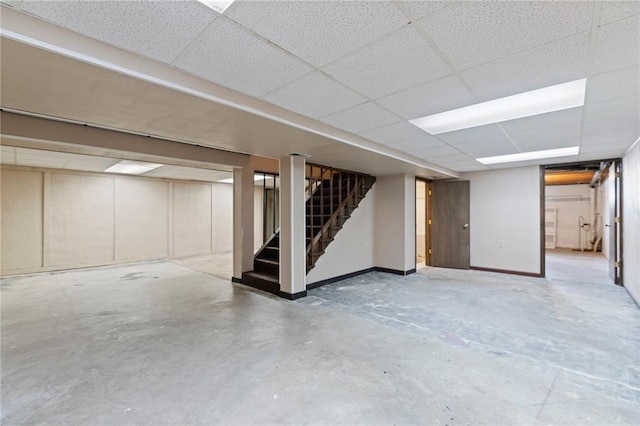 515 London Way, Belton, MO 64012 - finished below grade area featuring stairway, baseboards, and a drop ceiling