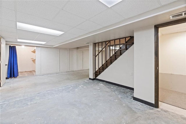 515 London Way, Belton, MO 64012 - finished basement featuring stairs, a paneled ceiling, and baseboards