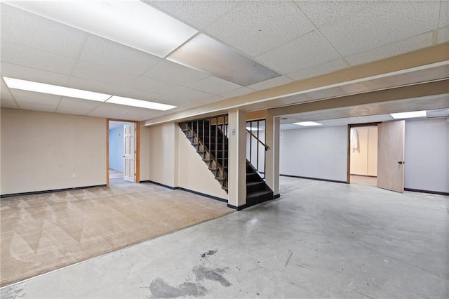515 London Way, Belton, MO 64012 - finished basement with stairs, baseboards, and a paneled ceiling