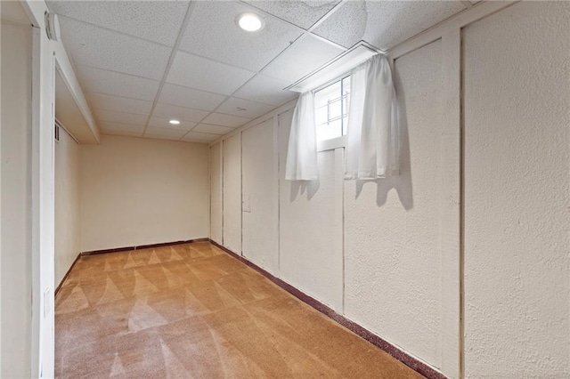 515 London Way, Belton, MO 64012 - below grade area with light carpet, a drop ceiling, a textured wall, baseboards, and recessed lighting