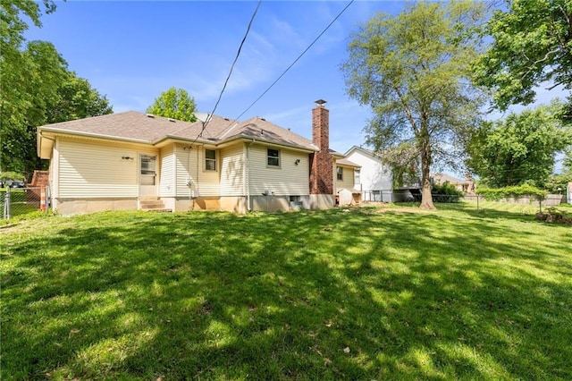 515 London Way, Belton, MO 64012 - rear view of property with entry steps and a chimney