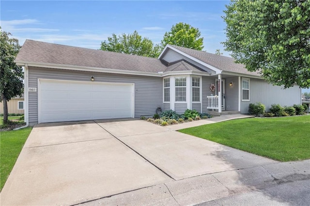 16611 E 53rd St, Independence, MO 64055 - ranch-style house featuring a front lawn, a garage, concrete driveway, and a shingled roof