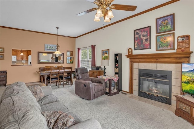 16611 E 53rd St, Independence, MO 64055 - living room with crown molding, ceiling fan, carpet flooring, a fireplace, and vaulted ceiling