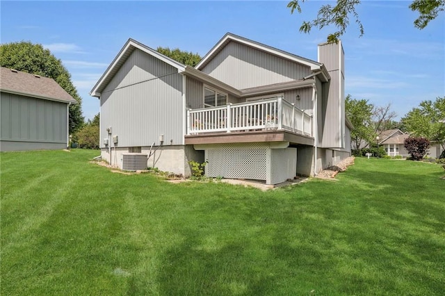 16611 E 53rd St, Independence, MO 64055 - rear view of property with central AC, a lawn, a wooden deck, and a chimney