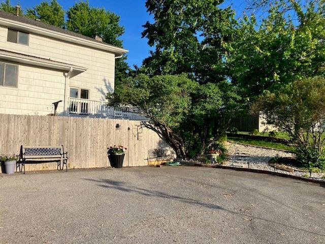 view of home's exterior featuring fence