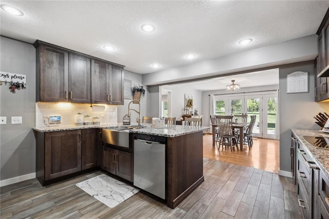 17201 NE 136th St, Kearney, MO 64060 - kitchen featuring dishwasher, a peninsula, wood finished floors, dark brown cabinets, and a textured ceiling