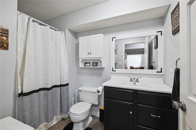 17201 NE 136th St, Kearney, MO 64060 - bathroom with vanity, wood finished floors, a textured ceiling, and a shower with shower curtain