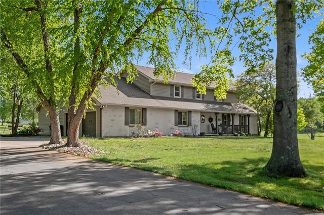 17201 NE 136th St, Kearney, MO 64060 - traditional home featuring covered porch, driveway, a front yard, and an attached garage
