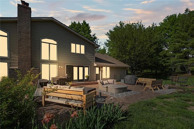 17201 NE 136th St, Kearney, MO 64060 - rear view of house featuring outdoor lounge area, a chimney, and a patio