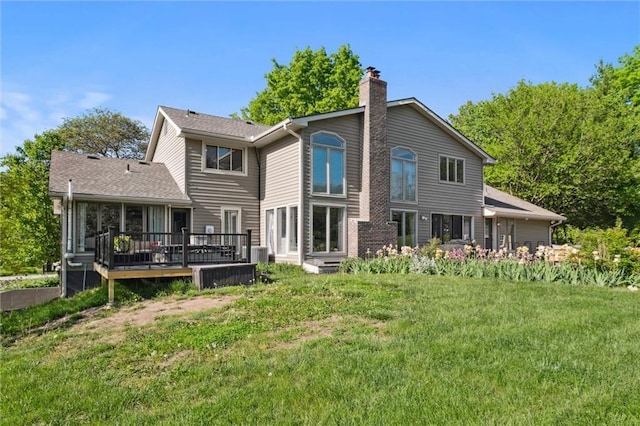 17201 NE 136th St, Kearney, MO 64060 - back of house featuring a chimney, a wooden deck, and a lawn
