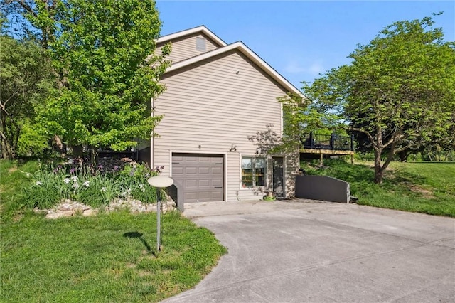 17201 NE 136th St, Kearney, MO 64060 - view of side of property featuring driveway, a wooden deck, and an attached garage