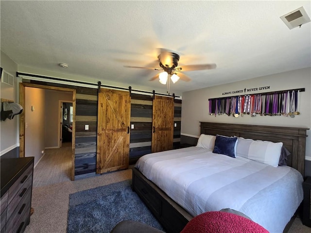 17201 NE 136th St, Kearney, MO 64060 - bedroom with a barn door, carpet floors, and a ceiling fan