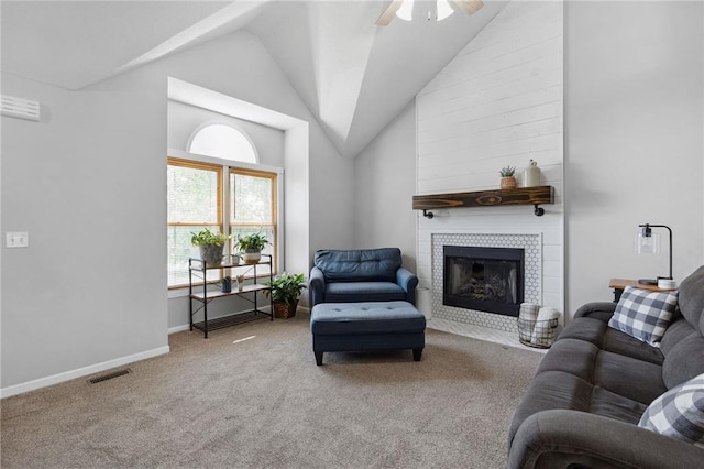11004 N Kentucky Pl, Kansas City, MO 64157 - living area with carpet flooring, vaulted ceiling, a ceiling fan, a fireplace, and baseboards
