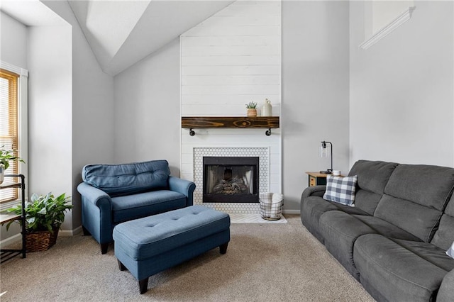 11004 N Kentucky Pl, Kansas City, MO 64157 - living area with carpet floors, vaulted ceiling, baseboards, and a tiled fireplace