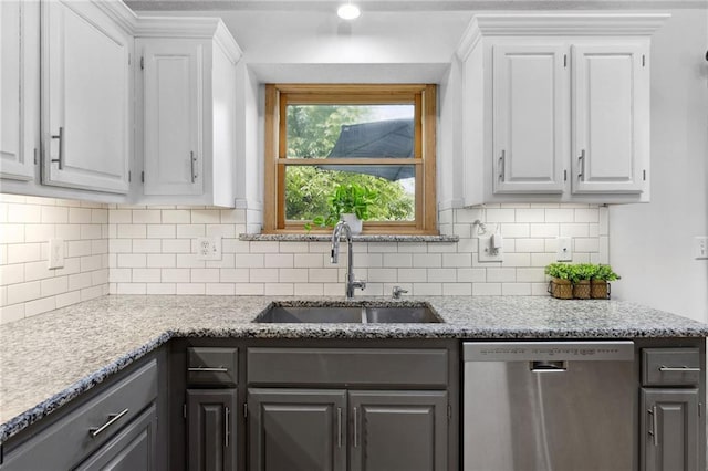 11004 N Kentucky Pl, Kansas City, MO 64157 - kitchen featuring stainless steel dishwasher, a sink, and white cabinetry
