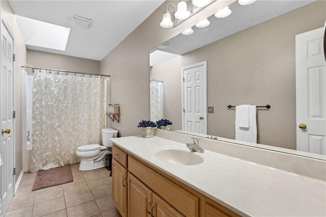 11004 N Kentucky Pl, Kansas City, MO 64157 - full bathroom featuring a skylight, tile patterned floors, toilet, vanity, and a shower with curtain