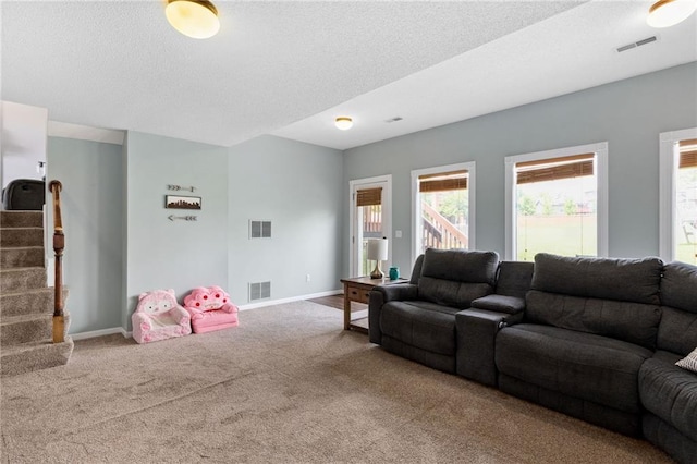11004 N Kentucky Pl, Kansas City, MO 64157 - living room featuring carpet flooring, stairway, baseboards, and a textured ceiling