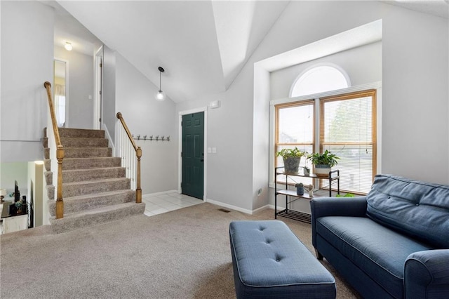 11004 N Kentucky Pl, Kansas City, MO 64157 - living room with high vaulted ceiling, carpet flooring, stairs, and baseboards