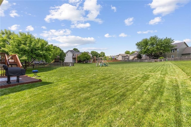 11004 N Kentucky Pl, Kansas City, MO 64157 - view of yard with a playground and a wooden deck